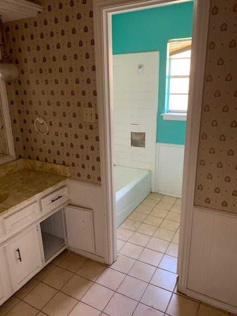 4819 73rd Street Lubbock, TX 79424 - Photo 4 of 7 a kitchen with a cabinets and a stove