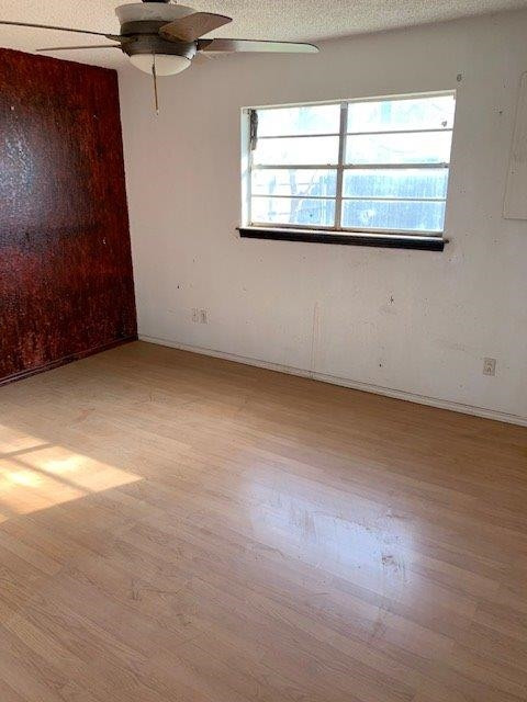 4819 73rd Street Lubbock, TX 79424 - Photo 6 of 7 an empty room with windows
