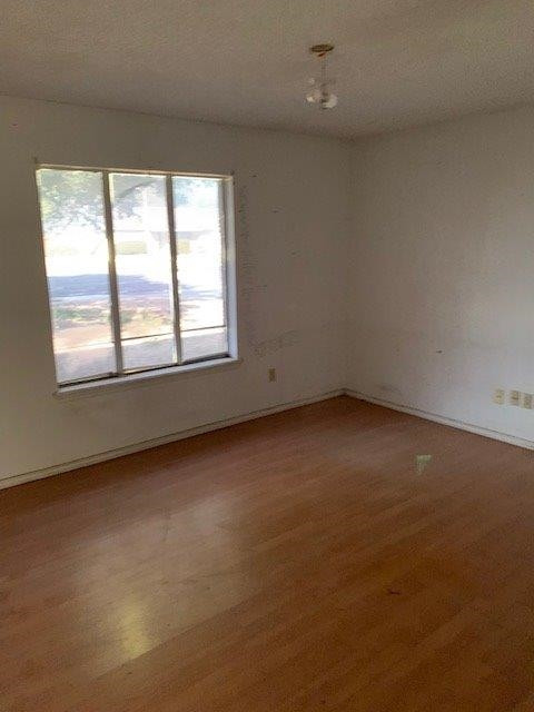 4819 73rd Street Lubbock, TX 79424 - Photo 7 of 7 an empty room with a window