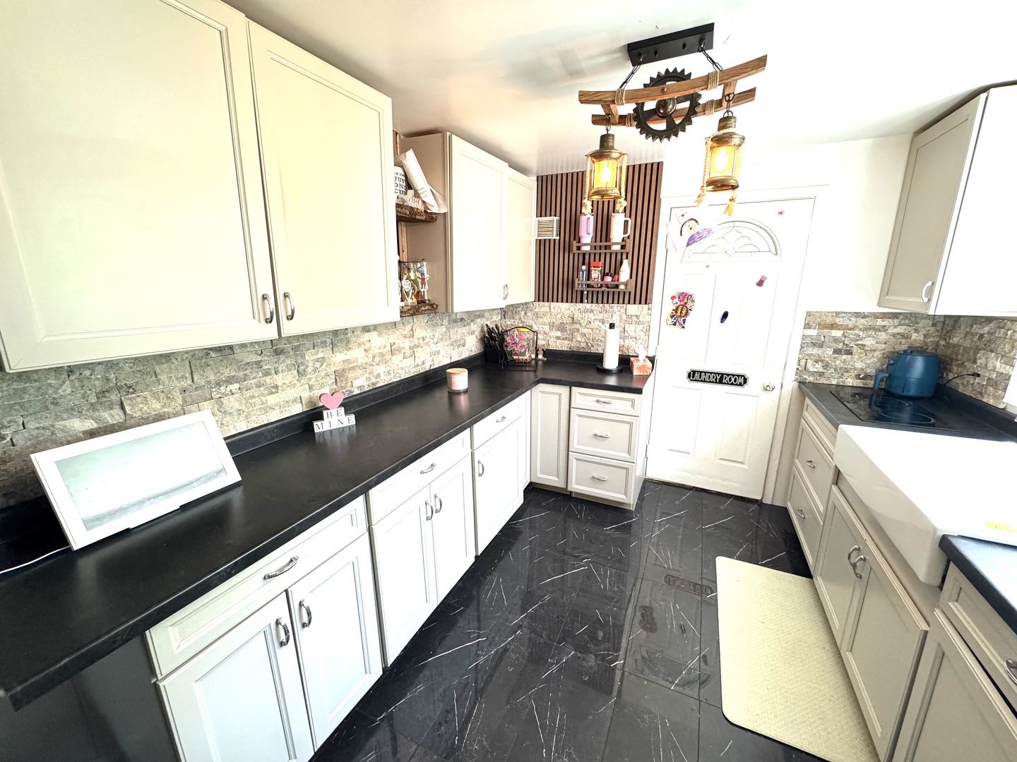 931 South Rawson Bridge Road Cary, IL 60013 - Photo 29 of 36 a large kitchen with a sink and a stove top oven