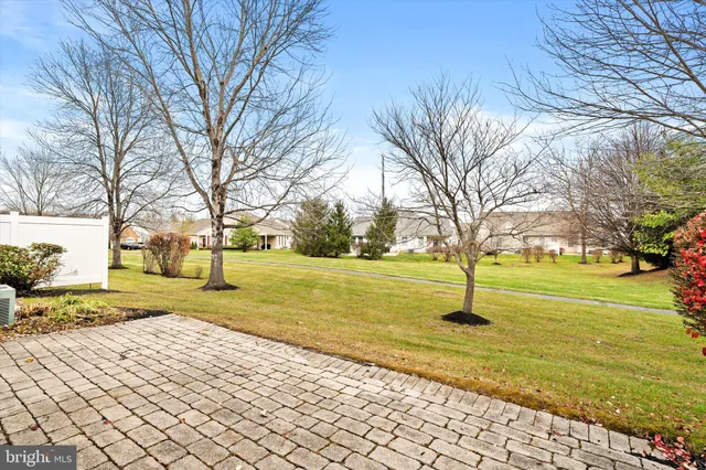 a view of residential houses with yard and swimming pool