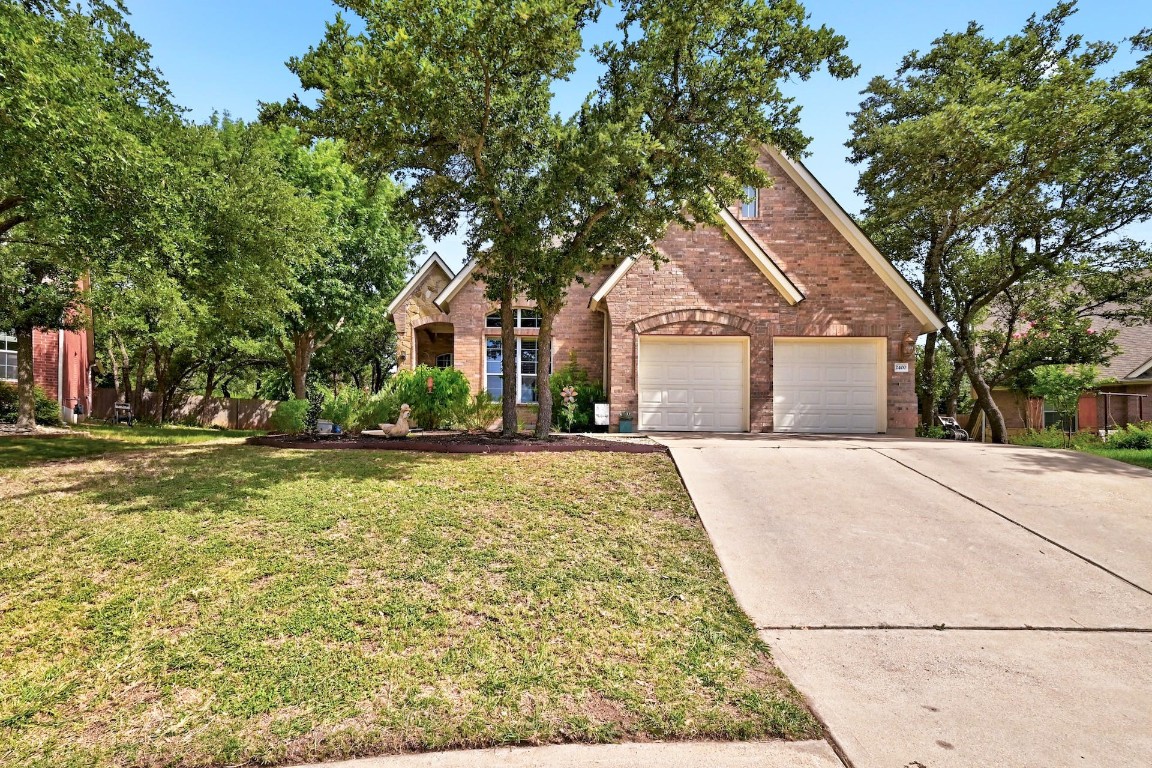 2400 Elkhorn Ranch Road Leander, TX 78641 - Photo 1 of 1 a front view of house with yard and green space
