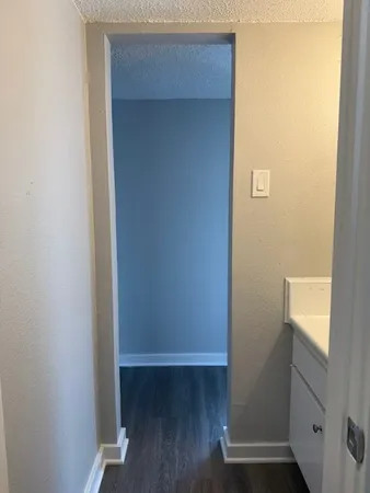 a view of front door with wooden floor