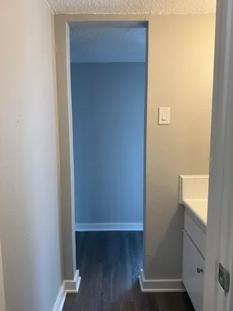 a view of front door with wooden floor