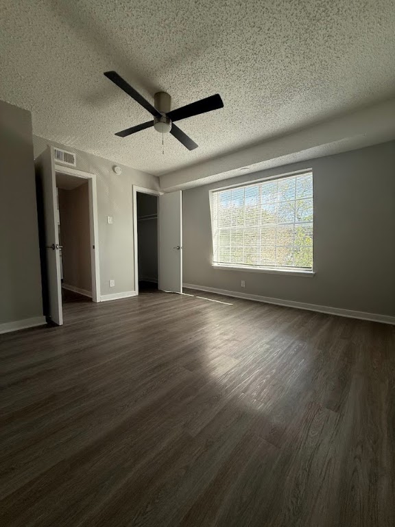 311 East 31st Street, Unit 103 Austin, TX 78705 - Photo 15 of 27 a view of an empty room with wooden floor and a window
