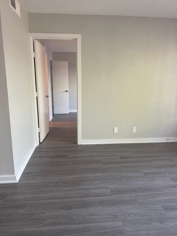 311 East 31st Street, Unit 103 Austin, TX 78705 - Photo 18 of 27 a view of a room with wooden floor