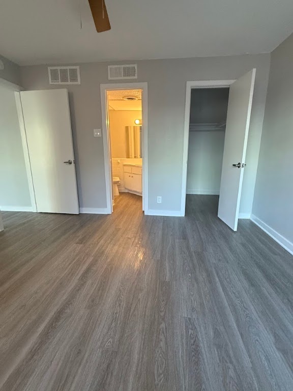 311 East 31st Street, Unit 103 Austin, TX 78705 - Photo 20 of 27 an empty room with wooden floor and closet