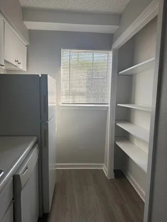 a view of an empty room with a window