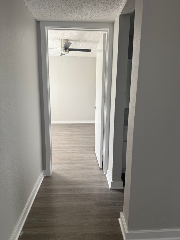 311 East 31st Street, Unit 103 Austin, TX 78705 - Photo 10 of 27 a view of a hallway with wooden floor