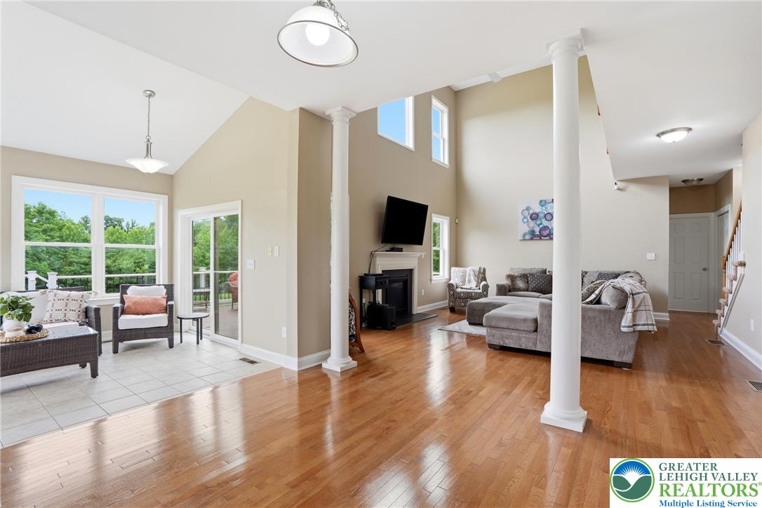 1212 Miller Road Wind Gap, PA 18091 - Photo 21 of 72 The great room features soaring vaulted ceilings and gleaming hardwood floors, perfect for grand entertaining.