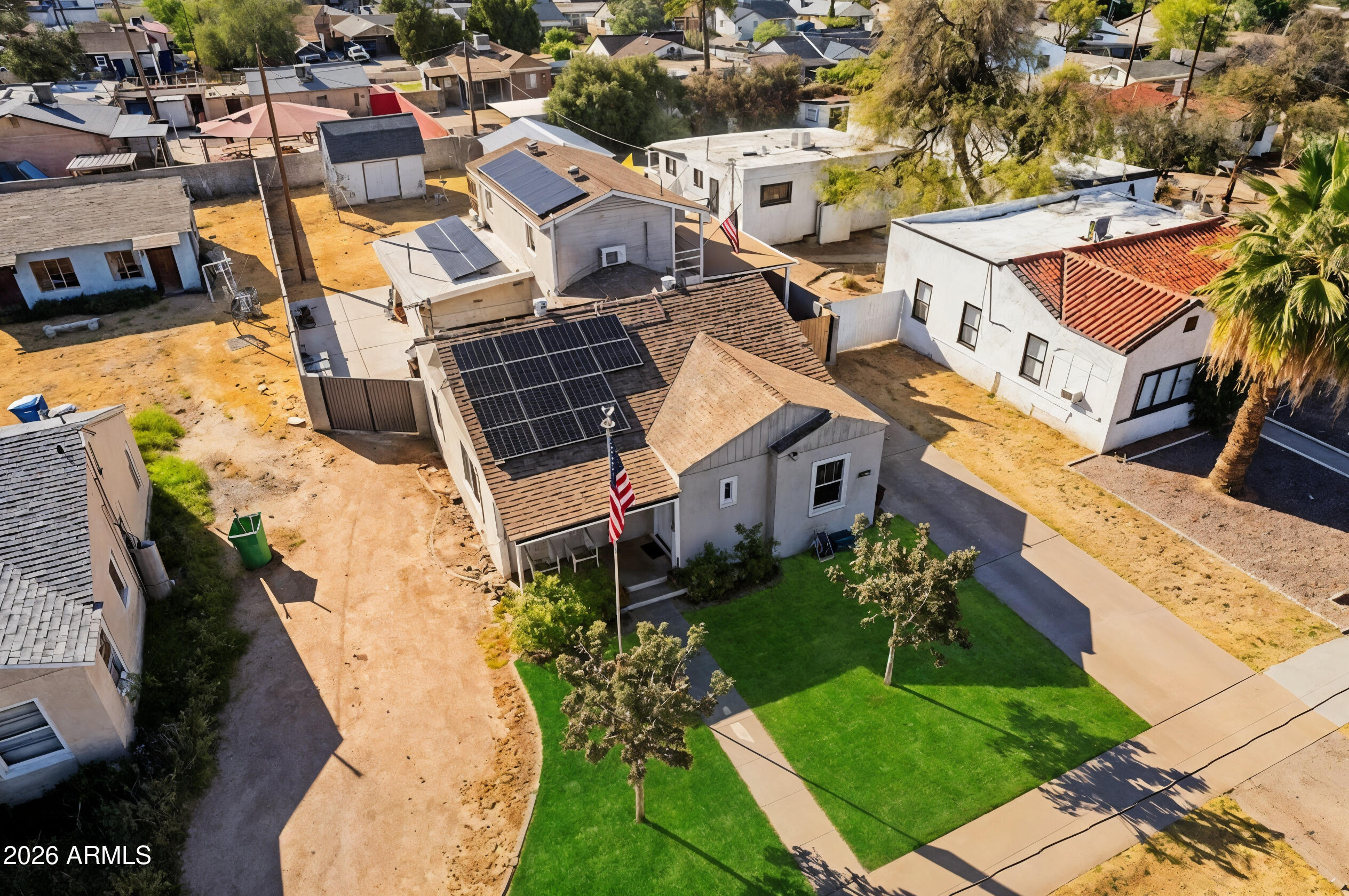 an aerial view of a house with a yard