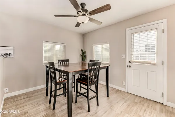 a bedroom with a bed and a refrigerator