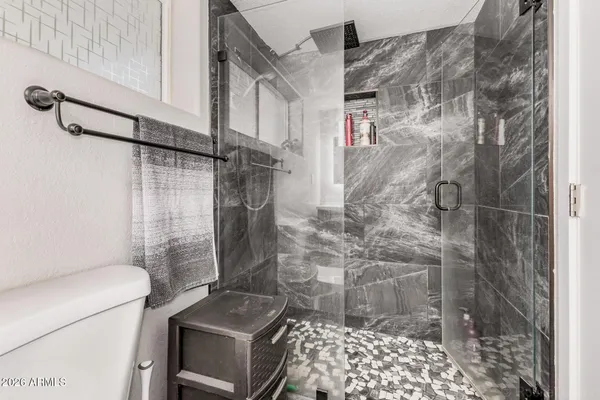 a bathroom with a sink a toilet and vanity