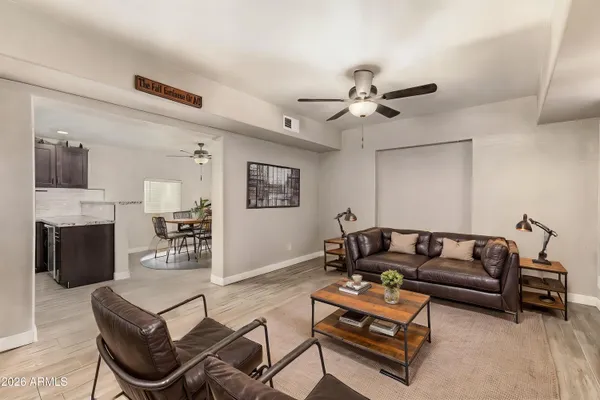 a bedroom with a bed and a lamp