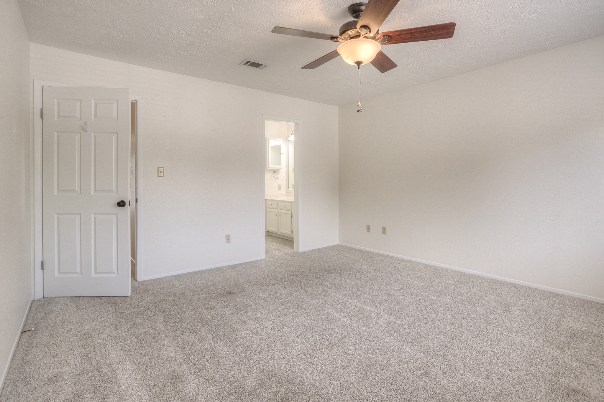 287 Broadmoor Street Trinity, TX 75862 - Photo 20 of 36 an empty room with windows and fan