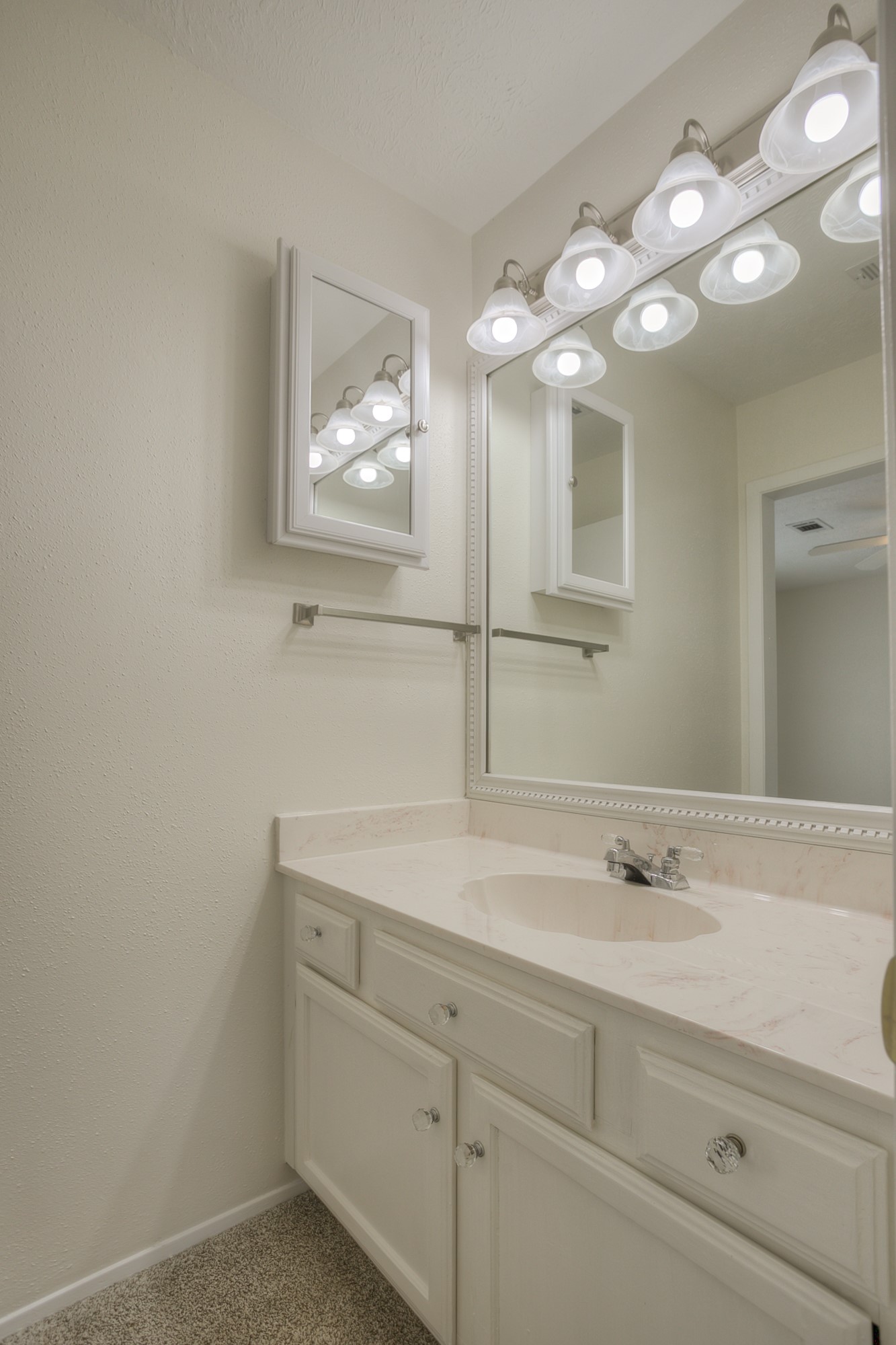287 Broadmoor Street Trinity, TX 75862 - Photo 22 of 36 a bathroom with a sink a light fixture and a mirror