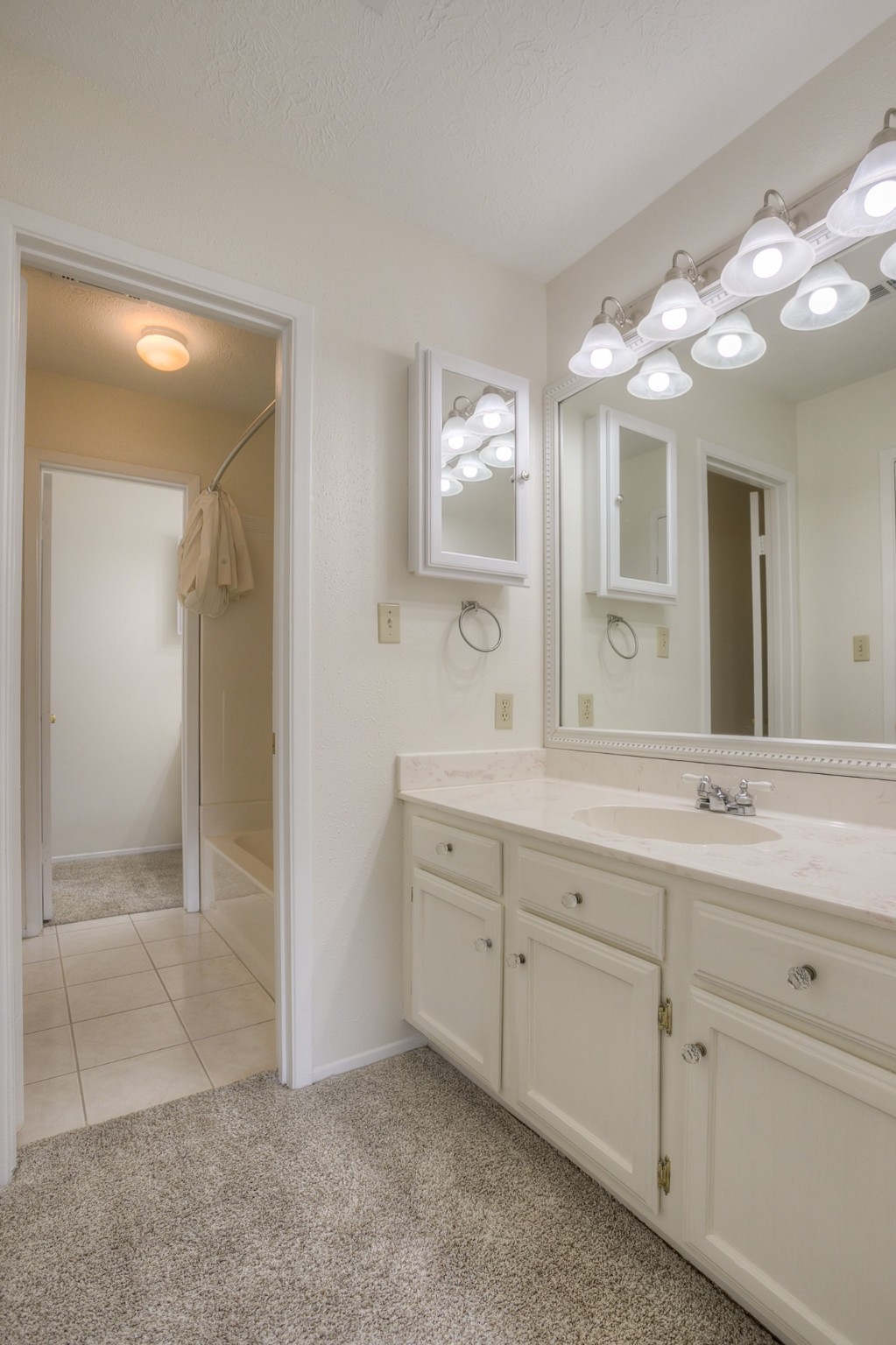 287 Broadmoor Street Trinity, TX 75862 - Photo 23 of 36 a bathroom with a double vanity sink and a mirror
