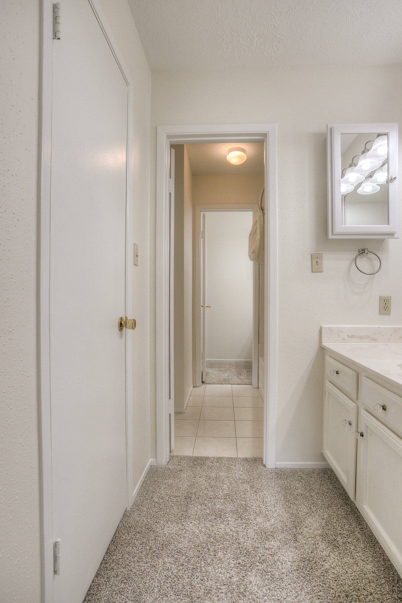 287 Broadmoor Street Trinity, TX 75862 - Photo 25 of 36 wooden floor with cabinet mirror and vanity