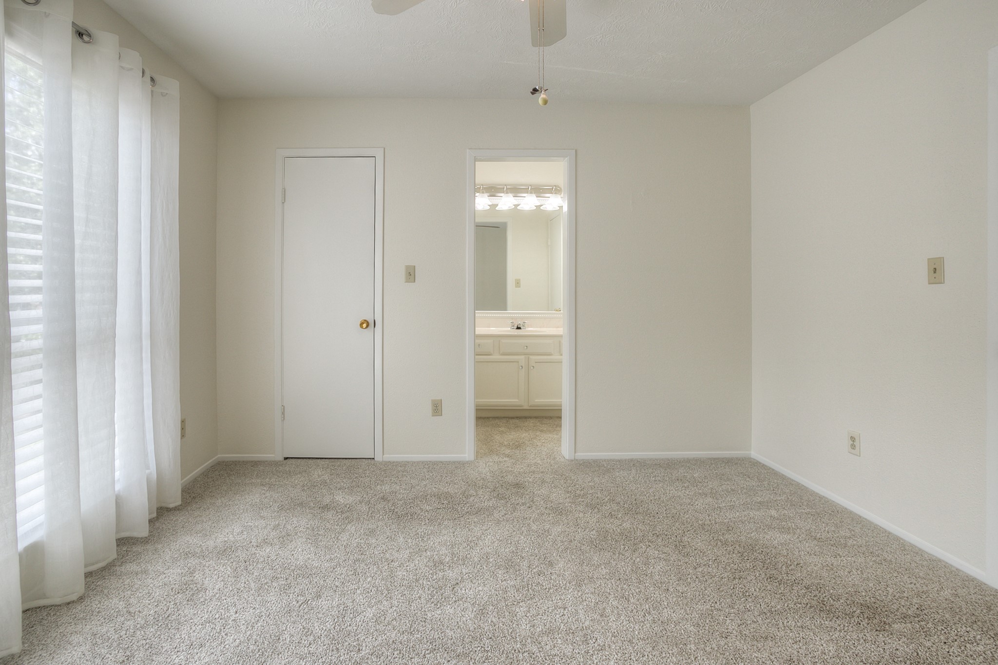 287 Broadmoor Street Trinity, TX 75862 - Photo 26 of 36 an empty room with an entryway and a window