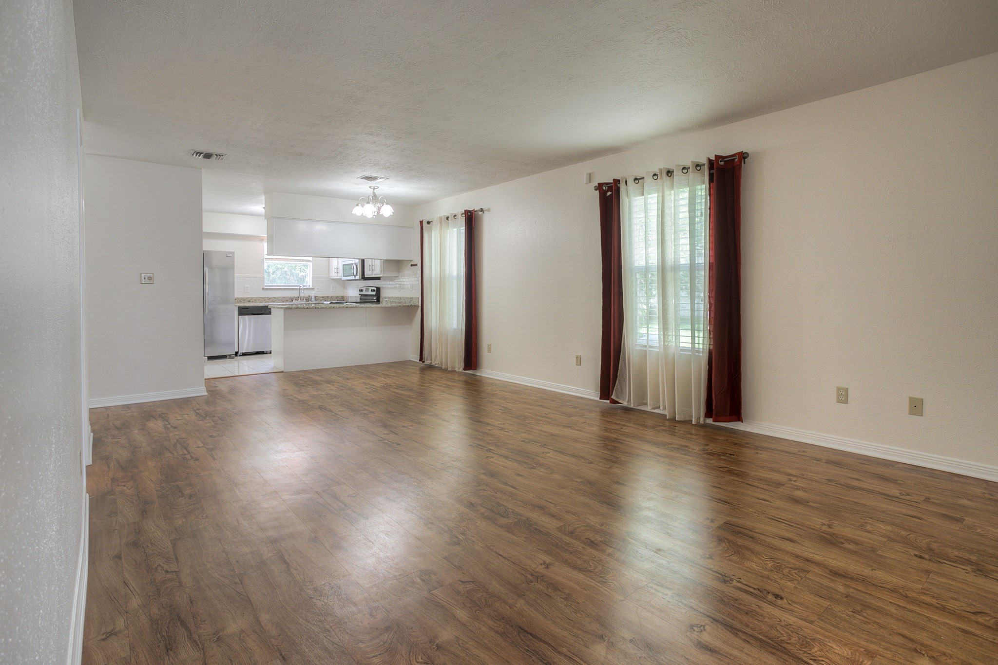 287 Broadmoor Street Trinity, TX 75862 - Photo 8 of 36 a view of a kitchen with a sink and a refrigerator