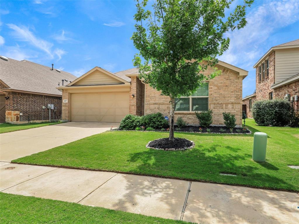4517 Ashmark Road Aubrey, TX 76227 - Photo 2 of 26 a front view of a house with garden