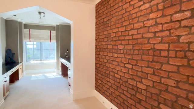 426 West Center Street Parowan, UT 84761 - Photo 53 of 107 Exposed brick accent wall complementing an arched entryway leading to a separate alcove
