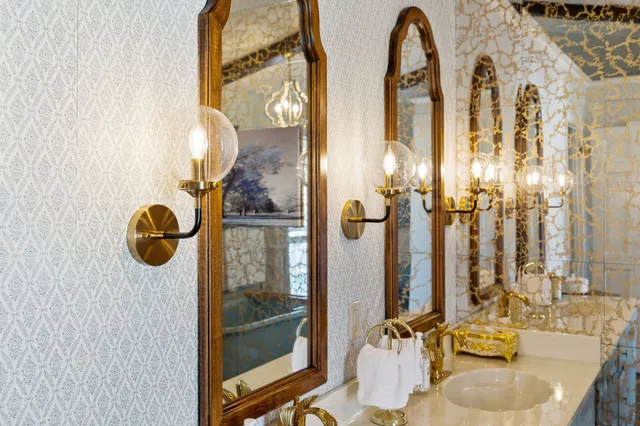 a white bath tub sitting in a bathroom next to a window