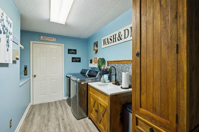a large kitchen with a table and chairs