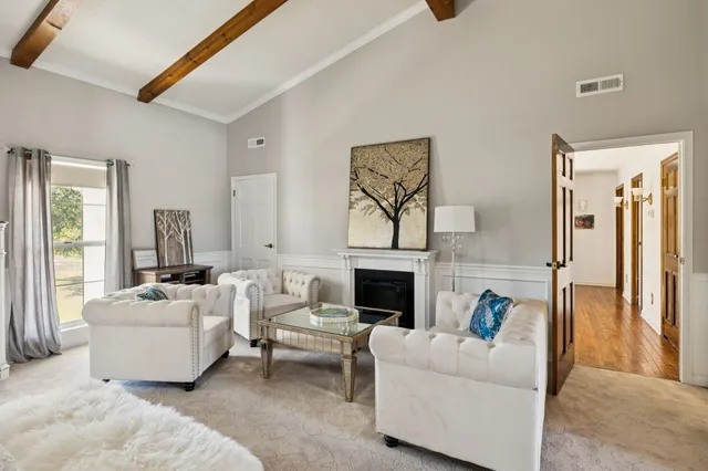 a living room with a couch and a table