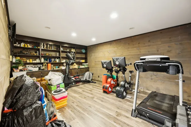 a view of a field with large trees