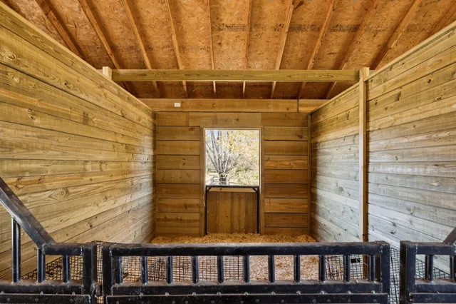 a view of a house with backyard and deck