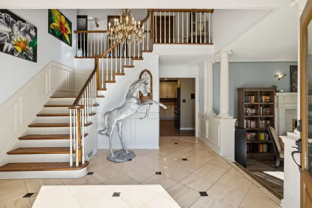 a kitchen with stainless steel appliances granite countertop a stove and a refrigerator