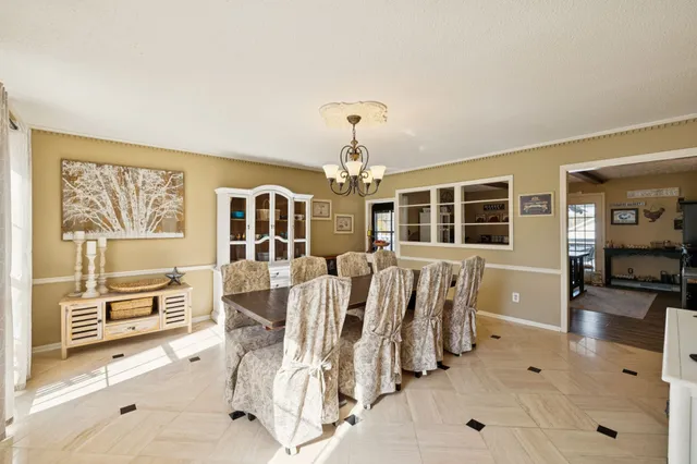 a bedroom with a bed a couch and dresser