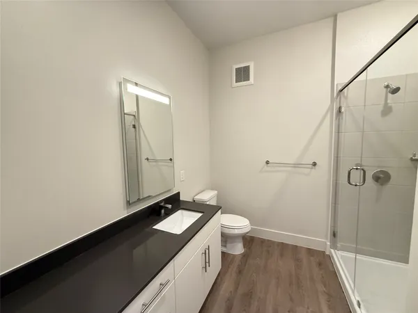 a view of bathroom with a sink and mirror
