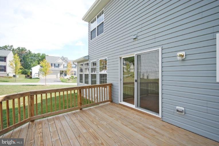 5976 Florey Road Hanover, MD 21076 - Photo 13 of 30 a view of a balcony with wooden floor