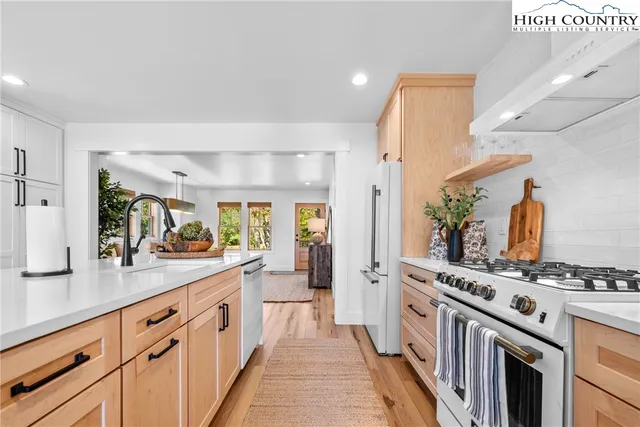 a kitchen with a stove and a sink