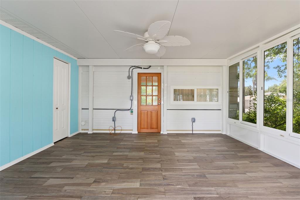 2092 Culbreath Road, Unit C52 Brooksville, FL 34602 - Photo 5 of 33 a view of empty room with wooden floor and fan