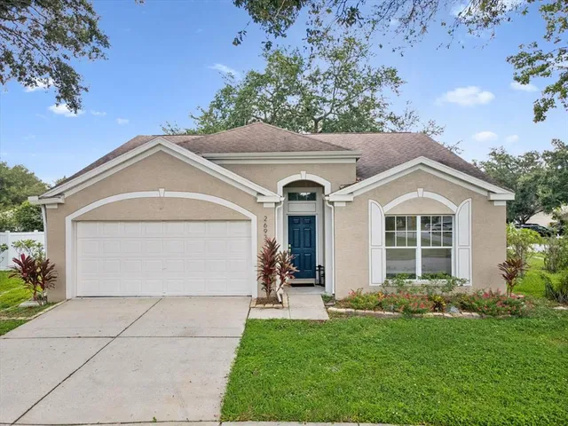 a view of a house with a yard