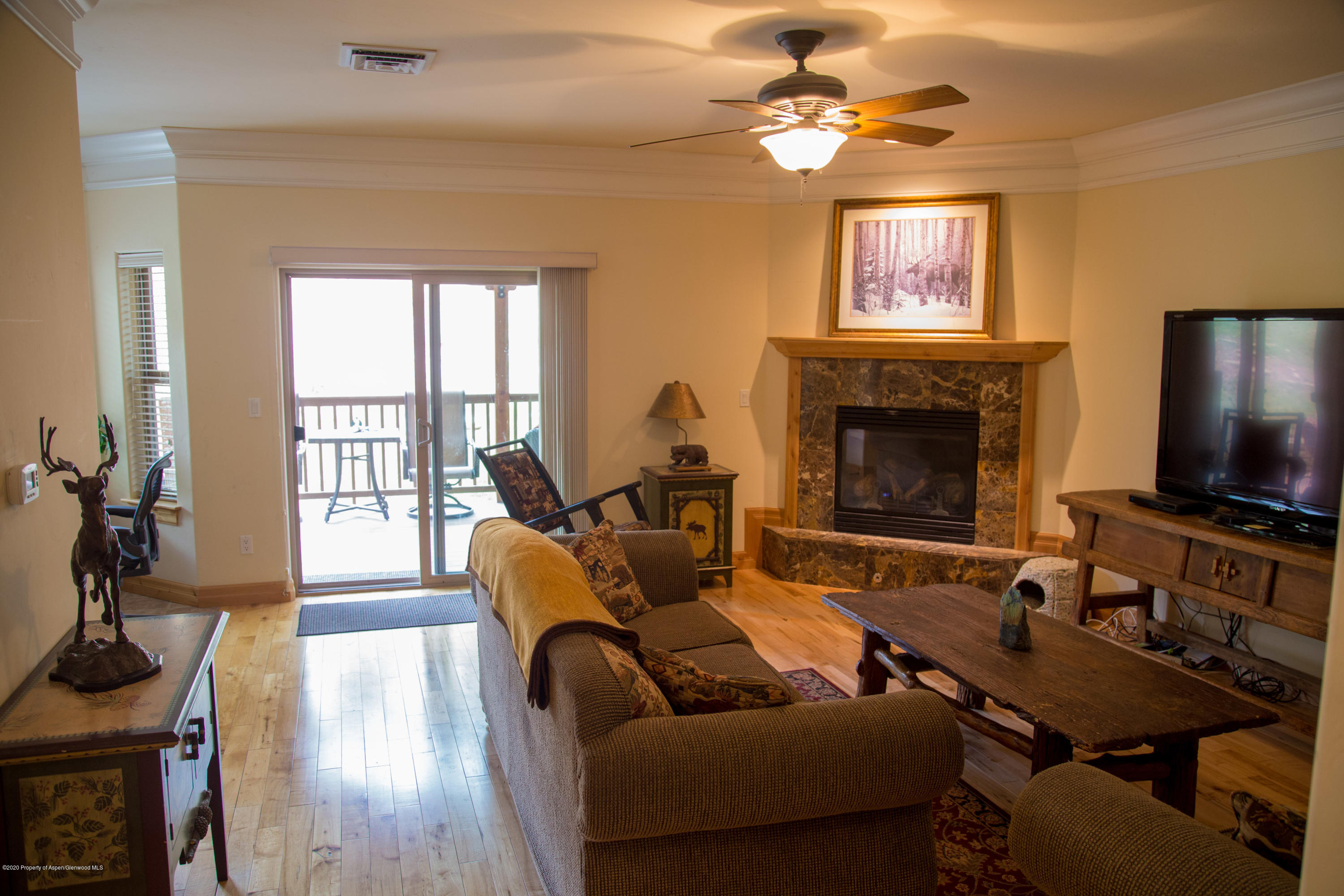 352 Faas Ranch Road New Castle, CO 81647 - Photo 7 of 21 Living area with gas fireplace