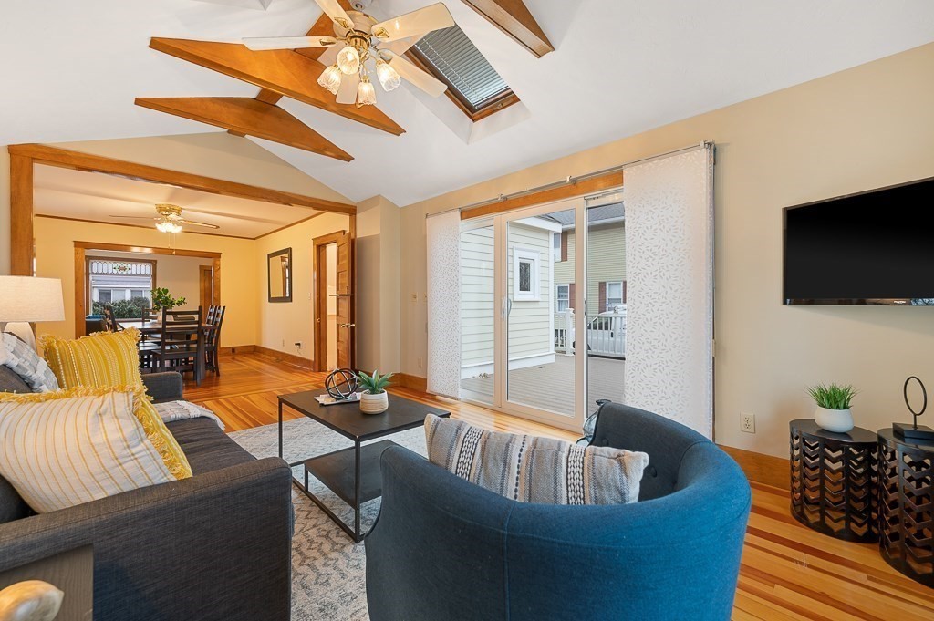17 George Street Framingham, MA 01702 - Photo 16 of 38 a living room with furniture and a flat screen tv