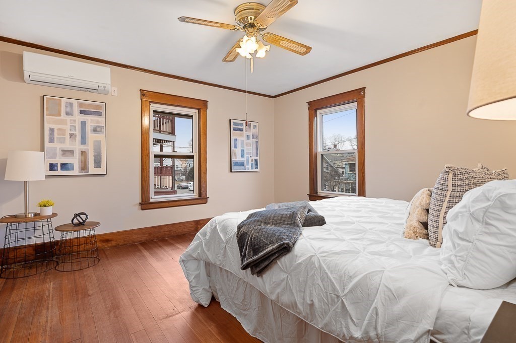 17 George Street Framingham, MA 01702 - Photo 19 of 38 a bedroom with a bed and wooden floor