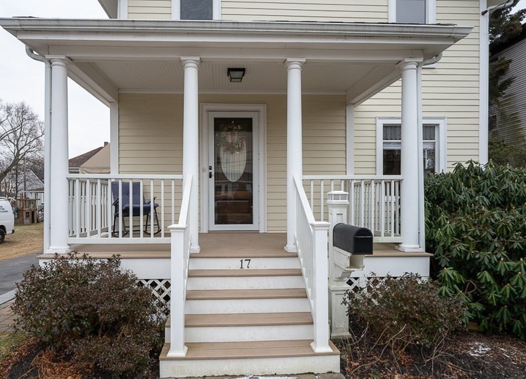 17 George Street Framingham, MA 01702 - Photo 2 of 38 a view of a house with a small window and potted plants
