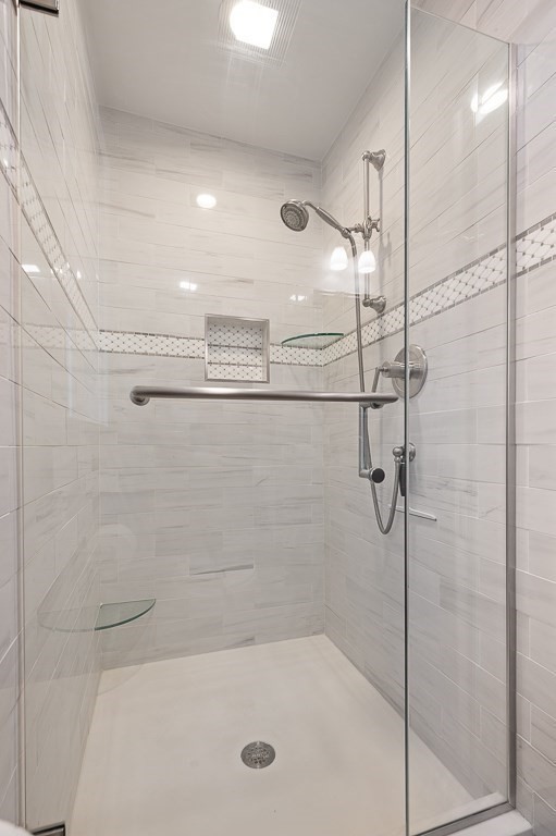 17 George Street Framingham, MA 01702 - Photo 21 of 38 a bathroom with a shower and a bath tub