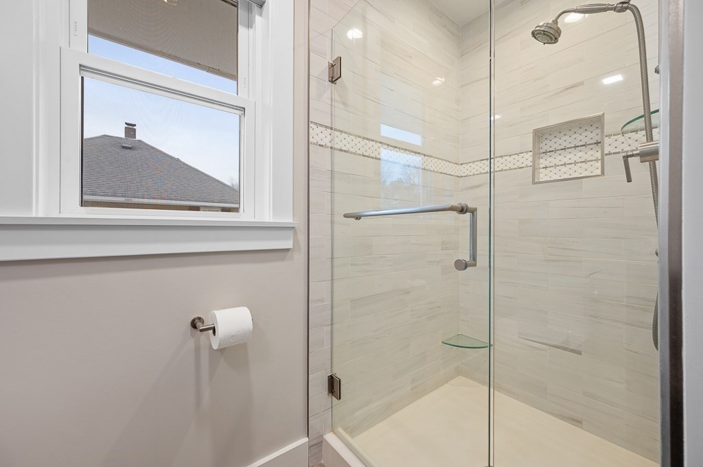 17 George Street Framingham, MA 01702 - Photo 22 of 38 a bathroom with a shower and a mirror