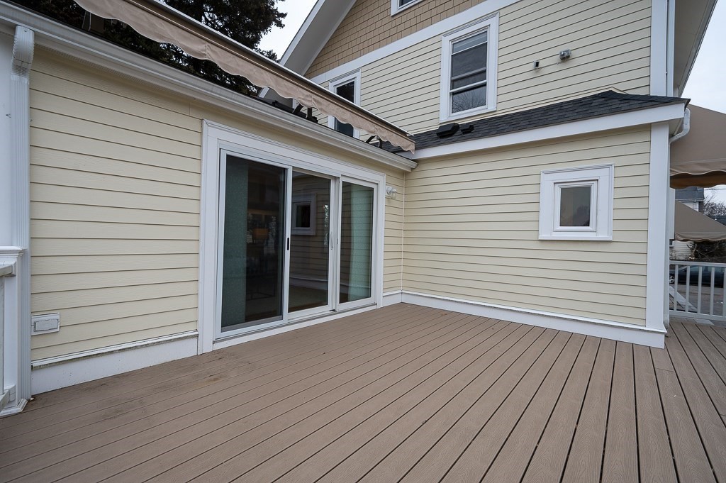17 George Street Framingham, MA 01702 - Photo 37 of 38 a view of a house with wooden deck