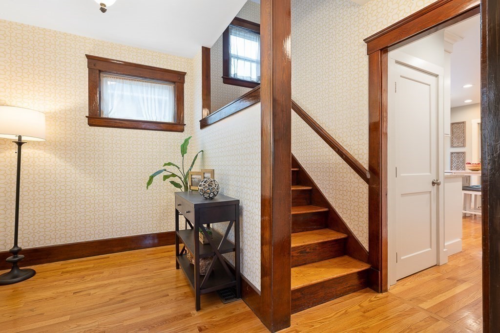 17 George Street Framingham, MA 01702 - Photo 5 of 38 a view of staircase with wooden floor and a rug