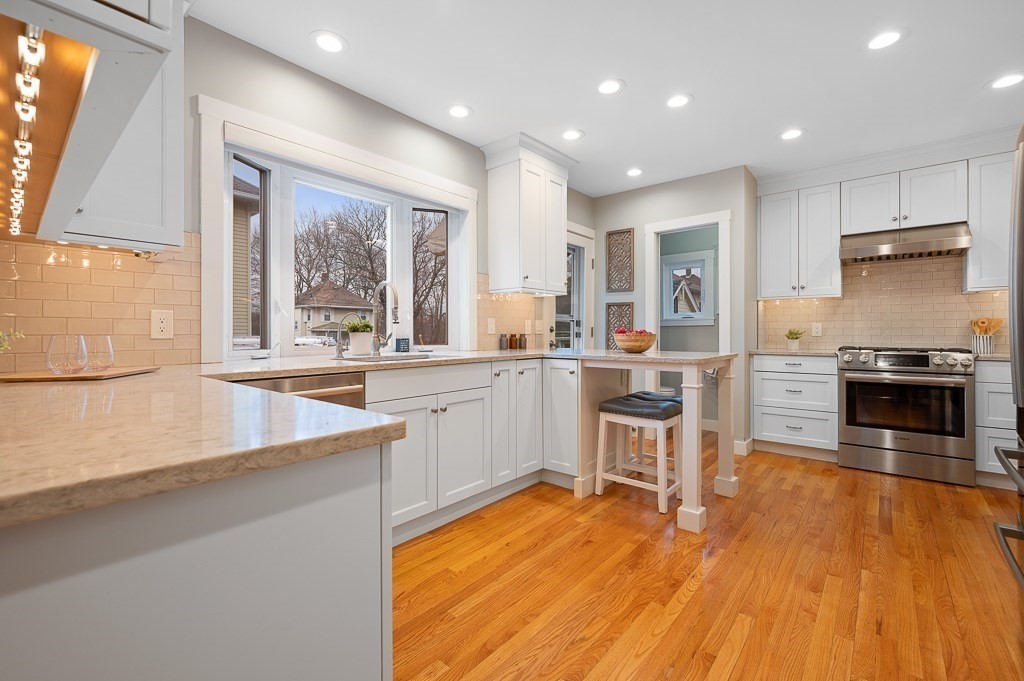 17 George Street Framingham, MA 01702 - Photo 8 of 38 a kitchen with stainless steel appliances granite countertop a stove a sink and a refrigerator