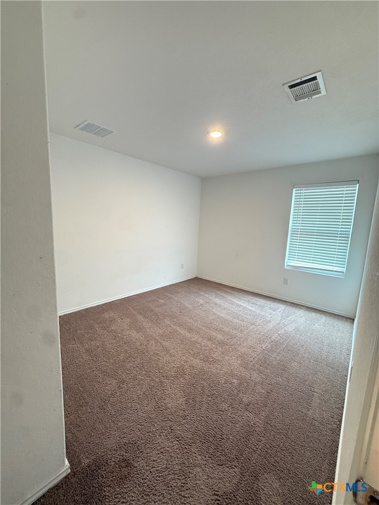 5863 Coahulia Ridge Seguin, TX 78155 - Photo 11 of 15 an empty room with windows