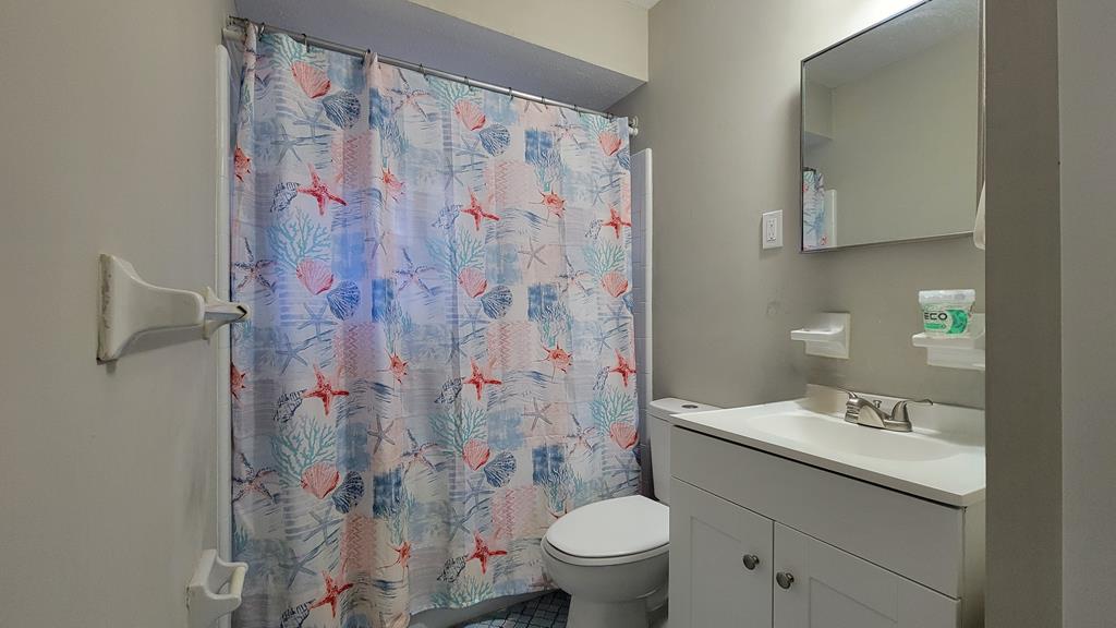 4804 Bruning Street Columbus, GA 31907 - Photo 11 of 14 a bathroom with a sink toilet and shower