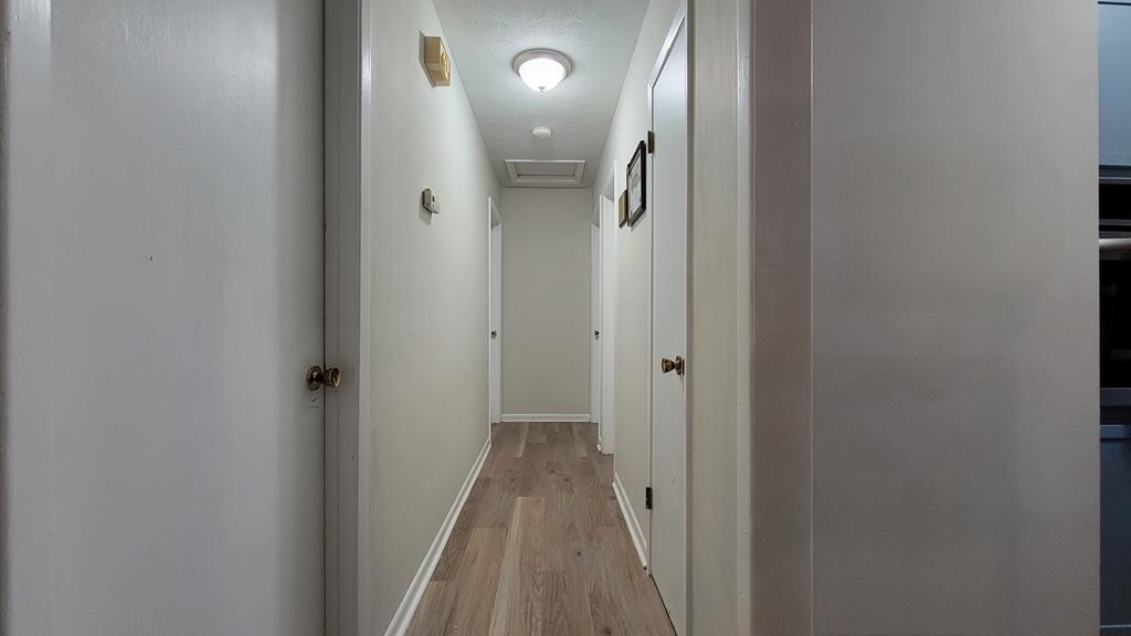 4804 Bruning Street Columbus, GA 31907 - Photo 13 of 14 a view of a hallway with wooden floor
